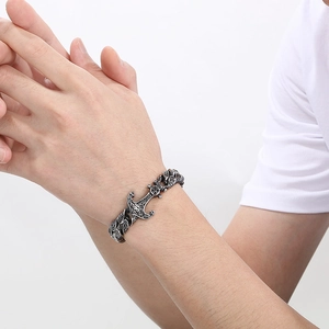 Vintage stainless steel men's anchor bracelet with ornate scrolls and Cuban link chain