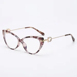 Chic cat eye eyeglasses with tortoiseshell frames and gold metal temples with rhinestones