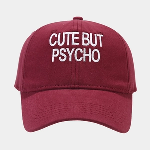 Classic burgundy baseball cap with white CUTE BUT PSYCHO embroidery and curved brim