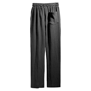 Detail of black waffle knit pants showing elastic waistband and texture