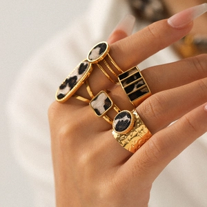 Set of five gold stainless steel rings with geometric leopard print patterns for women