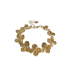 Vintage golden metal flower necklace with a minimalist design and lobster clasp