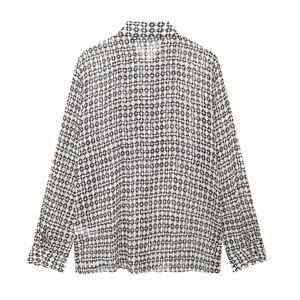 Detail view of French style chiffon blouse back featuring geometric print and pleated collar