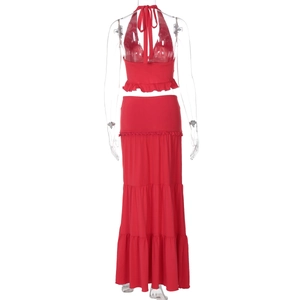 Detail of red backless halter top and tiered maxi skirt set with ruffle trim