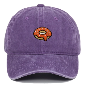 Detail of colorful donut embroidery on purple washed cotton baseball cap with retro texture