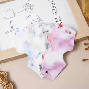Elegant marble pattern jewelry display cards for earrings and necklaces in fan-shaped layout