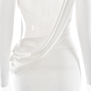Detail of the elegant white backless dress featuring a stylish draped waist design