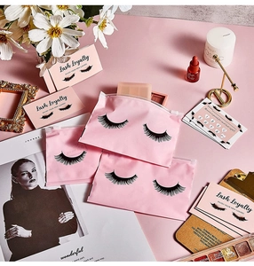 Pink eyelash zipper bags and loyalty cards set displayed on a matching background