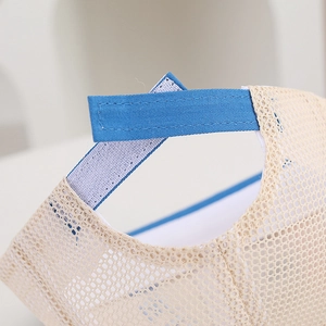 Close-up of adjustable velcro strap and breathable mesh on baby dinosaur sun hat