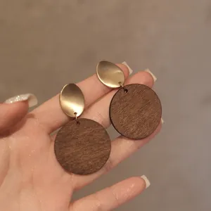Retro resin swirl round earrings with gold metal oval and dark brown wood pendant