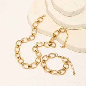 Detail of 18K gold-plated stainless steel chunky chain link necklace and bracelet set