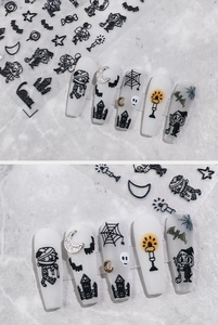 Macro detail of 5D Halloween nail stickers featuring black ghosts and gothic castle designs