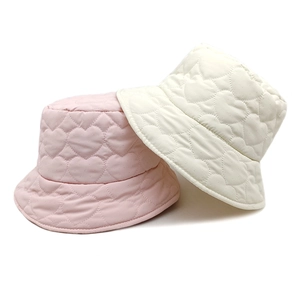 Quilted heart pattern bucket hats in pink and cream white with padded warmth