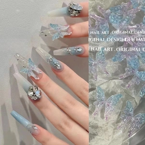 3D aurora resin butterfly nail charms with blue-purple gradient and sparkle glitter accents