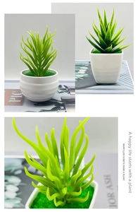 Detail view of artificial succulents in white ceramic pots on a modern office desk
