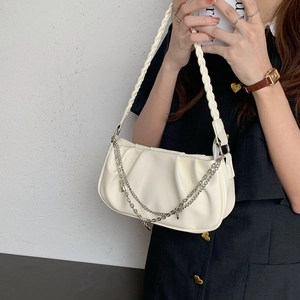 White pleated cloud shoulder bag with woven handle and elegant gold metal chain strap