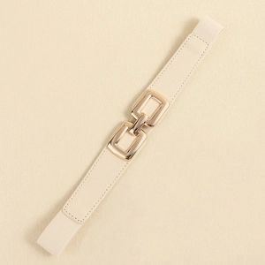 Detail of beige elastic waist belt with gold buckle and faux leather texture