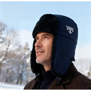 Detail of navy winter trapper hat with windproof fabric and warm faux fur lining