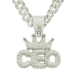Close-up of iced-out silver CEO crown pendant and matching iced Cuban link chain necklace