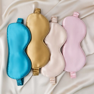 Set of four 22mm silk sleep masks in teal, gold, champagne, and pink colors