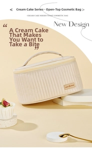Detail of cream-colored PU leather cosmetic bag with vertical quilting and top handle