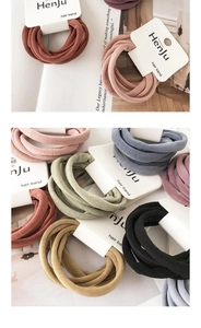 Detailed close-up of high-elasticity hair bands in Morandi colors with brand hang tags