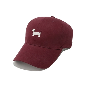Detail of dachshund embroidery on burgundy cotton baseball cap with six-row stitching