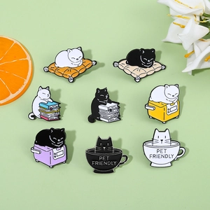 Set of 8 colorful enamel cat pins showing various daily activities on green background