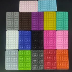 Array of colorful 40-cup square silicone suction pads for non-slip mobile phone holders