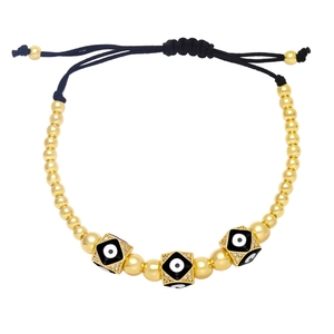 Close-up of golden beaded evil eye bracelet with adjustable black drawstring closure