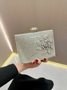 Elegant rhinestone evening clutch bag with crystal flower detail and large gem clasp