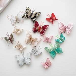 Colorful fabric butterfly ornaments with sequins and embroidery for festive decorations