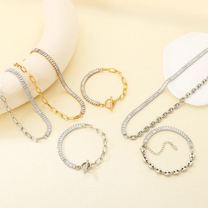 Detail of gold and silver OT buckle necklaces and bracelets with cubic zirconia accents