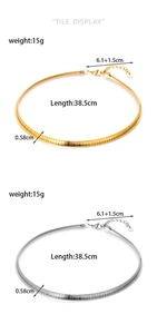 Flat lay of gold and silver snake bone chain necklaces with specific size measurements