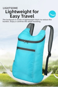 Ultralight water resistant foldable backpack shown floating with feathers to show its lightness