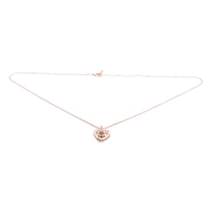 Rose gold heart pendant necklace with micro-paved zircon and evil eye design on white background