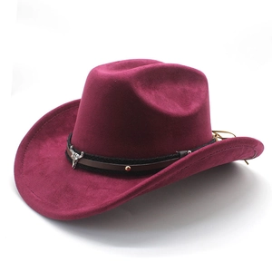 Detail of dark burgundy felt cowboy hat with braided leather band and silver bull skull buckle
