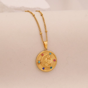 Detailed shot of gold moon and star pendant necklace with colorful cubic zirconia
