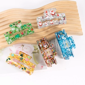 Five-piece Christmas acrylic hair claw set with glittery stars and holiday elements