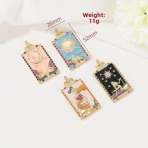 Detailed macro view of enamel tarot pendants with gold plating and colorful zircons