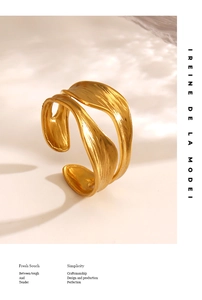 Detailed macro view of an 18K gold plated irregular leaf ring with brushed texture