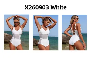 Detail of white one-piece swimsuit featuring sheer mesh panels and strappy back