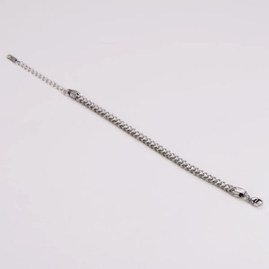 Detail of silver stainless steel Cuban link chain bracelet with lobster clasp