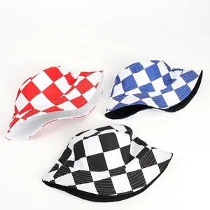 Flat lay of reversible checkerboard bucket hats in red, blue, and black canvas prints