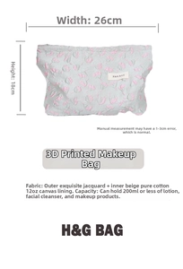 Detail view of floral embossed makeup bag showing 26cm width and cotton lining