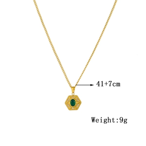 Detail of gold chain necklace with green gem pendant and technical size specifications