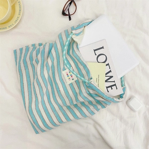 Blue wave stripe canvas tote bag showing large capacity for laptop and daily essentials