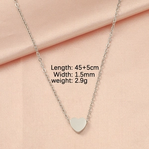 Silver heart pendant necklace on pink satin showing 45+5cm length and 1.5mm width details