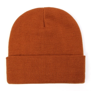 Close-up of caramel knit beanie showing detailed texture and ribbed cuff design