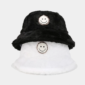 Thick plush bucket hat for women with embroidered smiley face in black and white colors